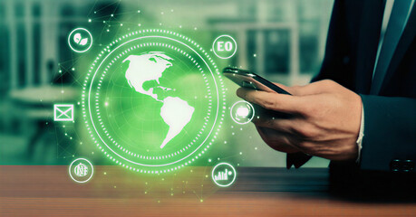 Global Connectivity Man Using Phone with World Map and Tech Icons Overlay