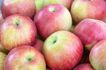 Fresh ripe red apples as background, top view