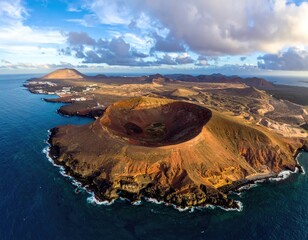 Aerial volcano island view, ocean water and cloudy skies