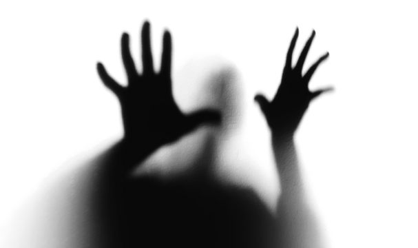 Scary silhouette of person with hands against surface, isolated on transparent cutout background