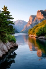 Fototapeta premium Fjord landscape reflecting mountains at golden hour