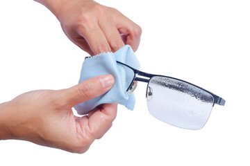 Cleaning eyeglass lenses. Black eyeglasses for women and men, isolated on background.