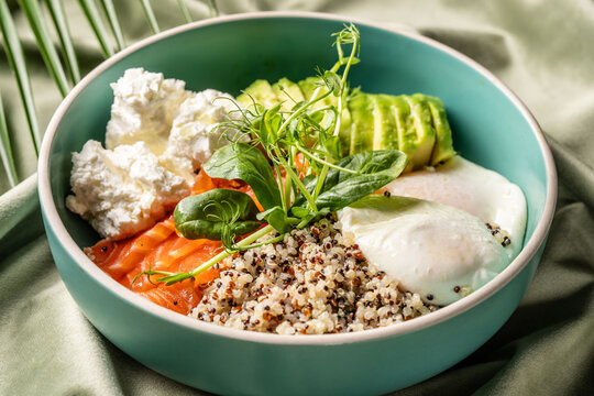 Healthy quinoa bowl with salmon and avocado