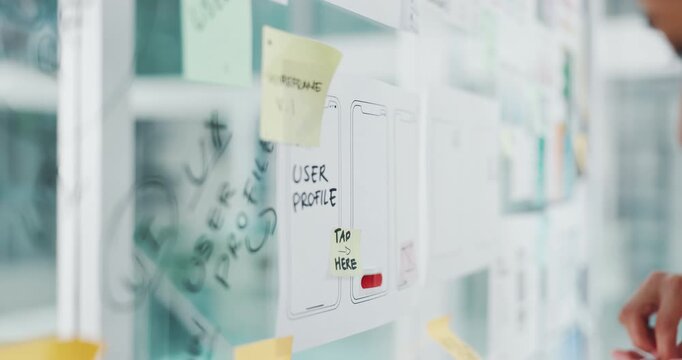 Hands, person and notes on glass in office with ux design, ui layout and interface planning. Staff, meeting and app icons with wireframe for user experience, review template and ideas for software