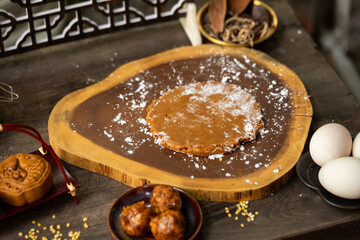 Traditional mooncake dough preparation on wooden board