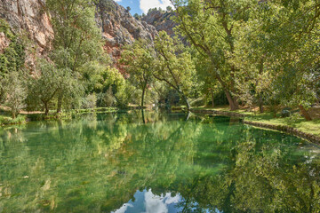 A haven of peace at the Monasterio de Piedra, the lake surrounded by leafy trees and rock formations