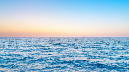 Fototapeta premium Vast ocean horizon with colorful sunset sky creates peaceful atmosphere