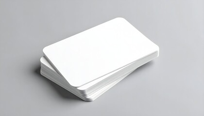 Fototapeta premium Minimalist white business card mockup on a wooden block with natural light and plant shadows