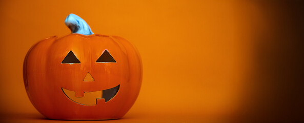Jack-o'-lantern on oramge background, Halloween banner