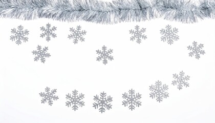 Silver tinsel arch with multiple silvery snowflake ornaments on a white backdrop