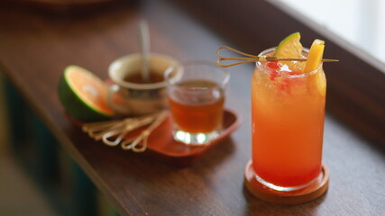 peach tea and decorations on the side
