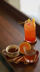 peach tea, orange slice, cup of tea