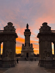 Madrid, Spain - July 9, 2025: Monument to Alfonso XII, colonnade and Great Pond in El Retiro Park