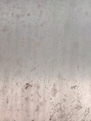 Grungy weathered white metal surface with rust stains and scratches