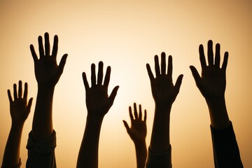 Fototapeta premium Silhouetted hands raised against warm gradient sky background, symbolizing unity, volunteering, freedom, or protest with abstract light effect. Ai generative