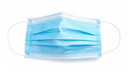 Close-up of a light blue disposable face mask with ear loops, white background