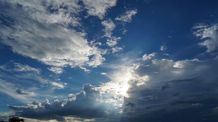 Dramatic sky with clouds and sunlight breaking through the cloudscape view.