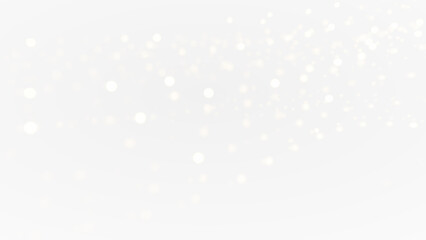 Gold lights are flying in the air against a black background