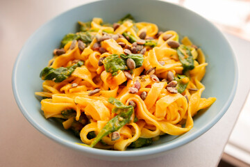 delicious pumpkin tagliatelle pasta with spinach fall cozy dinner close up