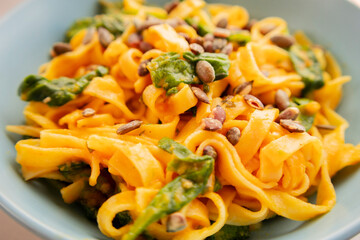 delicious pumpkin tagliatelle pasta with spinach fall cozy dinner close up