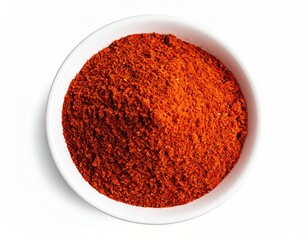 Red spice powder fills white bowl. Aerial close-up