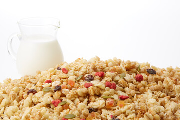Fruit granola and milk on a white background