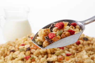 Fruit granola and milk on a white background