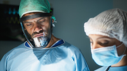 Medical team examine x-ray in surgery room