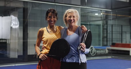 Fitness, women and face on court for padel tournament, game win or sportsmanship. Athletes, mature people and team hug with celebration at health club for friendly match, competition or challenge