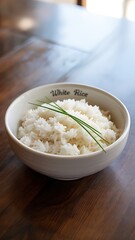 Delicious bowl of healthy white ceramic food with fresh green garnish on a wooden table