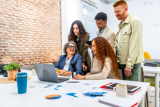 Diverse business team collaborating during office podcast or meeting