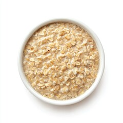 Creamy oatmeal in a small white bowl, viewed from directly above on a white background