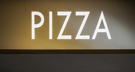 The word Pizza is highlighted in white on a gold background