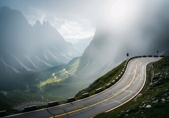 Winding Mountain Road Through a Foggy Valley in the Dolomites