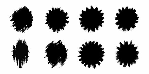 Collection of black ink splatter brush stroke shapes and starburst elements on white background