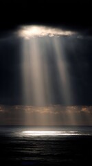 Dramatic Sun Rays Over Dark Ocean