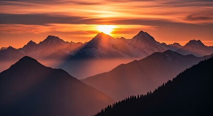 Obraz premium Majestic Mountain Range Bathed in Golden Sunrise Light.