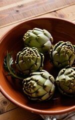 Obraz premium Harvesting artichokes in a rustic kitchen culinary focus organic fresh produce warm natural lighting