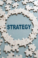 Puzzle Pieces Forming Circle with Strategy Words in Center