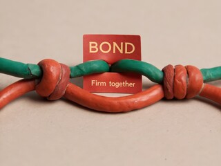 Colorful Clay Strings with Bond Sign Depicting Strong Connection