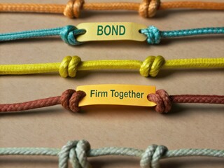 Colorful Knotted Ropes with Inspirational Labels for Unity and Connection