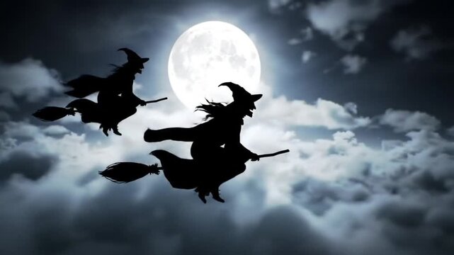 Spooky Witches Silhouetted Flying on Broomsticks Across a Full Moon and Stormy Night Sky.