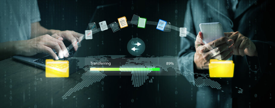 Secure file transfer concept showing data synchronization between laptop and smartphone, symbolizing cloud storage, digital communication, and modern business technology.