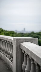Ornate white balustrade overlooking distant cityscape lush greenery cloudy sky