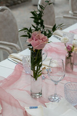 Elegant Private Event Venue Prepared for an Intimate Lunch Gathering With Delicate Floral Arrangements and Soft Pink Table Linens