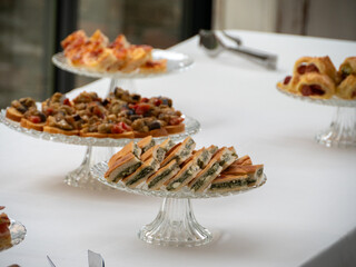 Elegant Assortment of Appetizers Displayed on Crystal Stands at an Italian Villa Patio Buffet Party Event Gathering