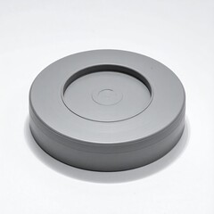 Round, gray, plastic container with circular inset