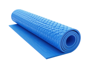 A partially rolled-up blue textured yoga mat on a dark background