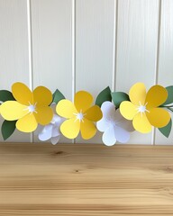 Paper-cut yellow & white flowers with green leaves arrangement