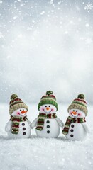 A Christmas or New Year's card with snowmen standing under falling snow and a place for the text	
